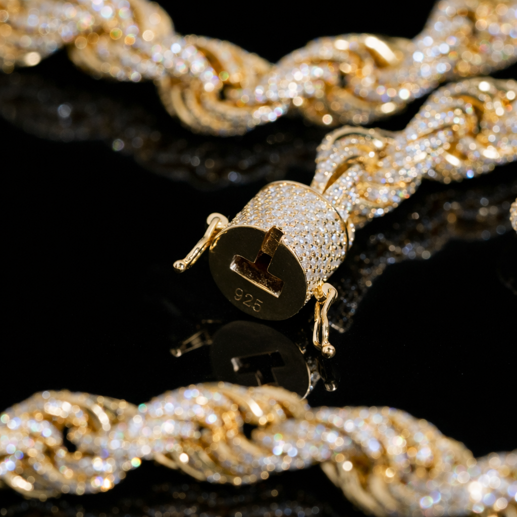 Gold chain with a diamond lock clasp on a black background